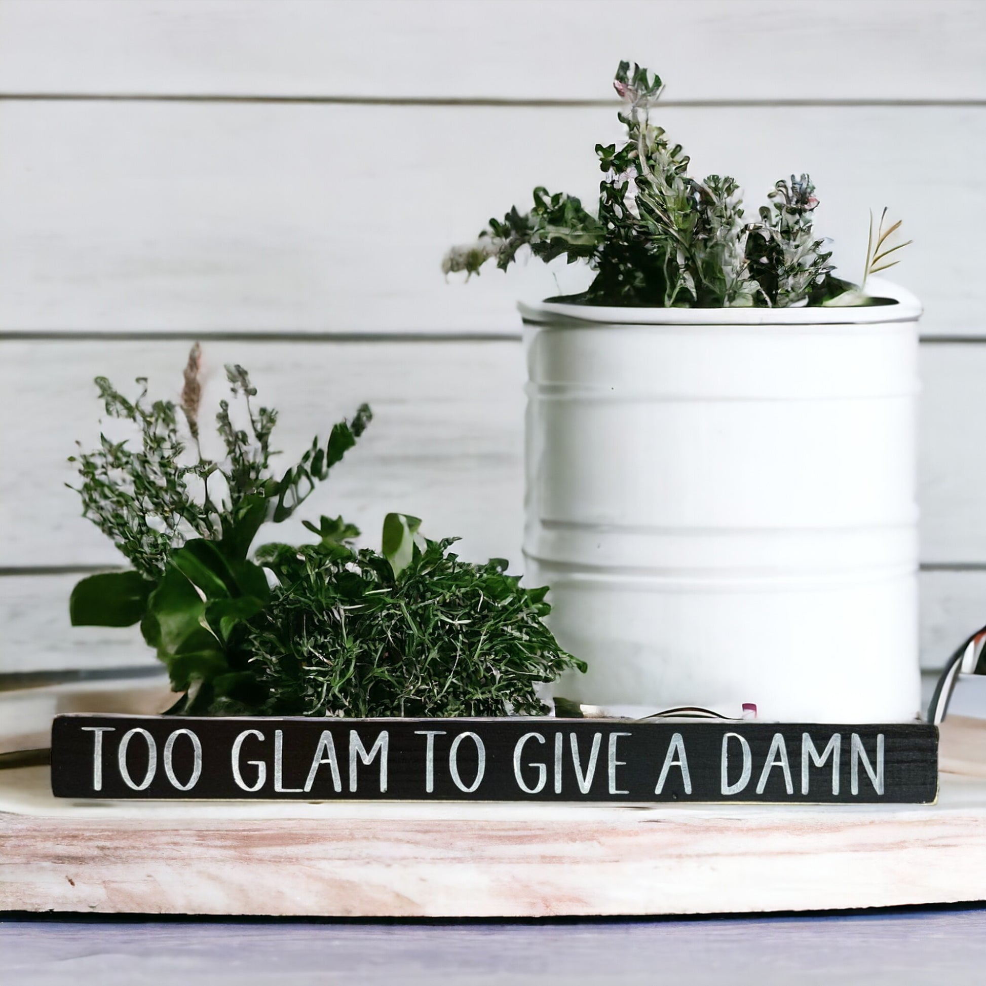 Handpainted black wood sign with white text reading 'Too Glam To Give A Damn,' freestanding 16-inch sarcastic decor for female office or home.