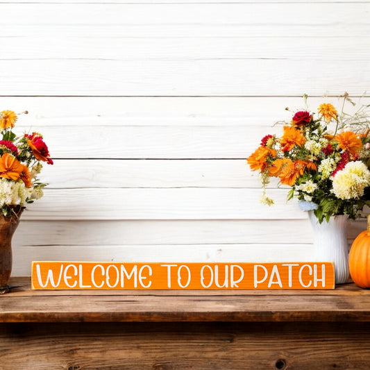 Hand-painted orange wood sign with white text reading 'Welcome To Our Patch' - perfect pumpkin patch sign for farmhouse fall decor.