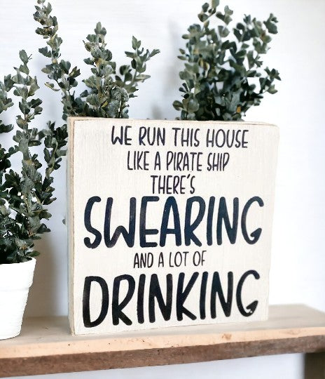 Quirky mini wood block sign featuring humorous saying in black text on white background."