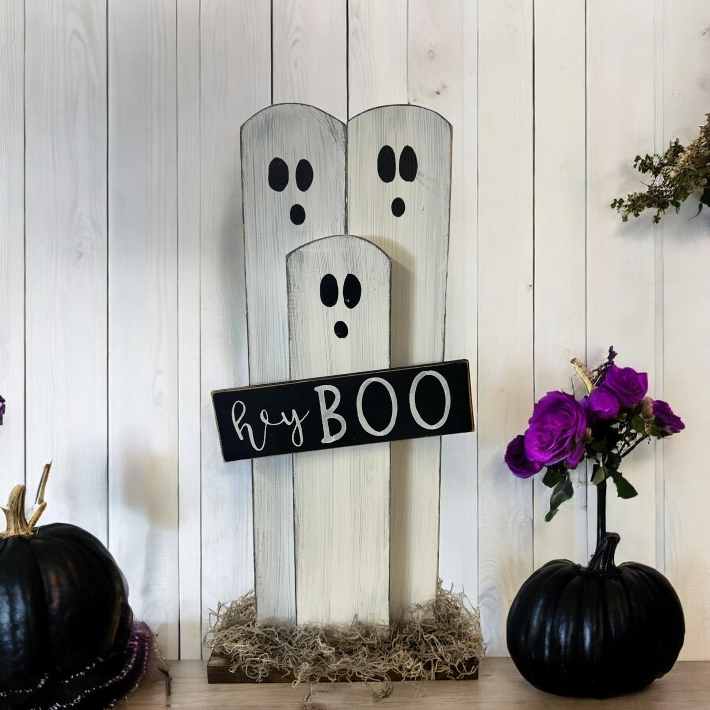 Handcrafted ghost decoration with a "Hey Boo" sign, ideal for Halloween porch and mantel decor.