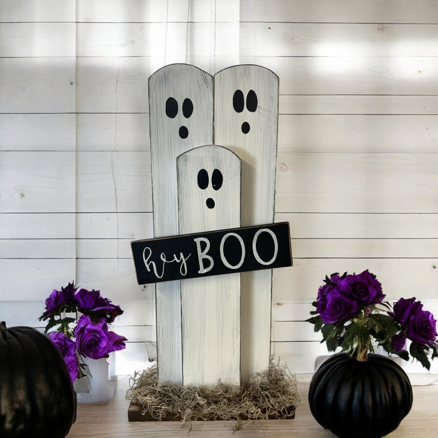 Handcrafted ghost decoration with a "Hey Boo" sign, ideal for Halloween porch and mantel decor.