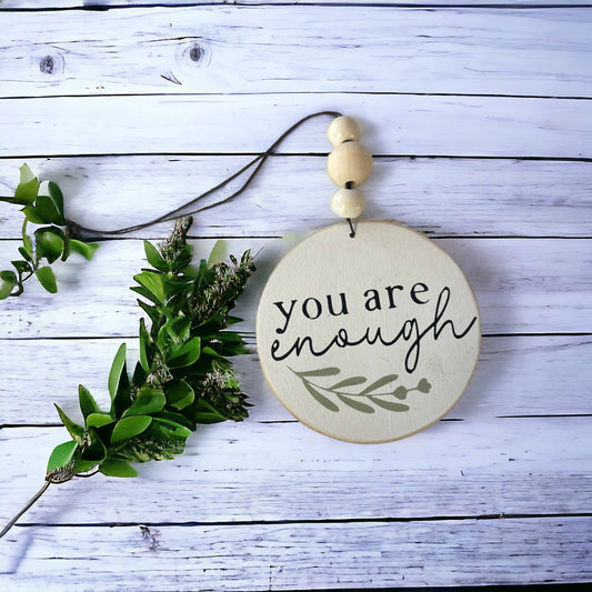 4-inch wooden car charm with 'You are Enough' quote, hand painted white with black text, for rearview mirror.