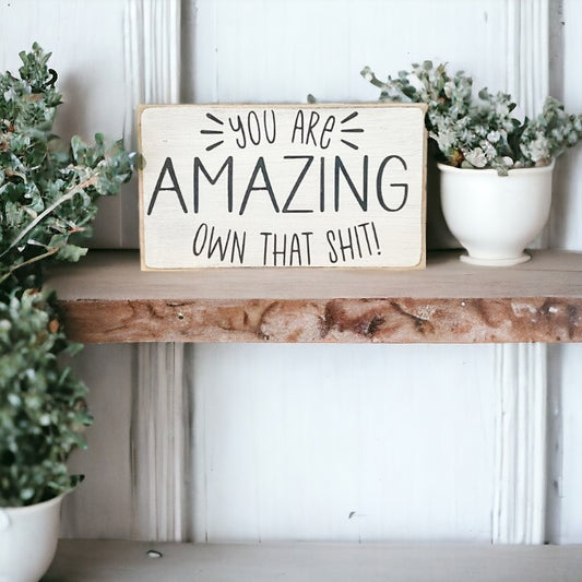 Image of 'You Are Amazing' wood block sign with bold black text on crisp white background, perfect inspirational gift for women